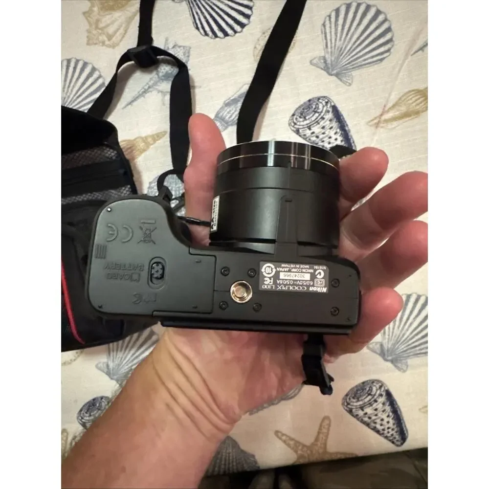 Nikon Black Camera with Matching Black Carry Case and Red Trim